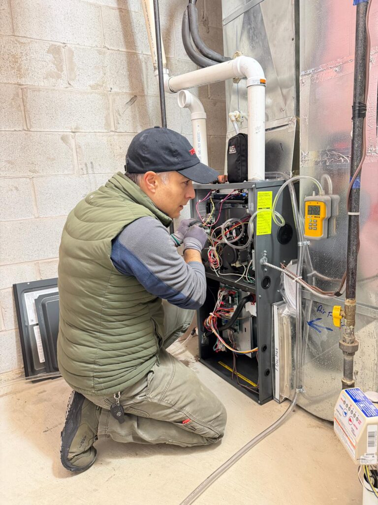 Common Reasons Your Heat Isn't Working Heat Isn't Working Heat Isn't Working,Heating Systems,Heater,HVAC furnace repair Furnace repair technician inspecting and fixing a home heating system during professional HVAC maintenance